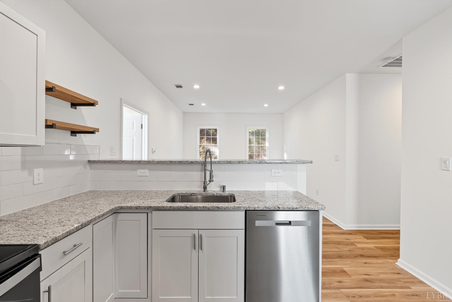 504 Amherst Street Lynchburg, VA 24504 - Photo 15 of 37 a kitchen with kitchen island granite countertop counter top space and cabinets