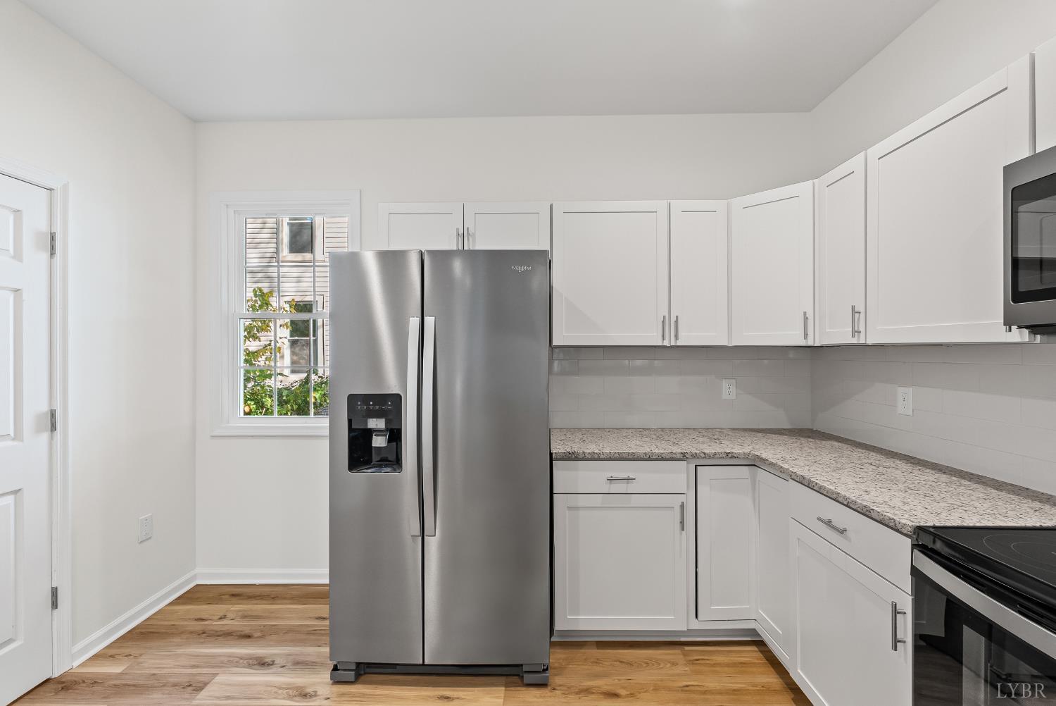 504 Amherst Street Lynchburg, VA 24504 - Photo 16 of 37 a kitchen with stainless steel appliances a refrigerator and cabinets