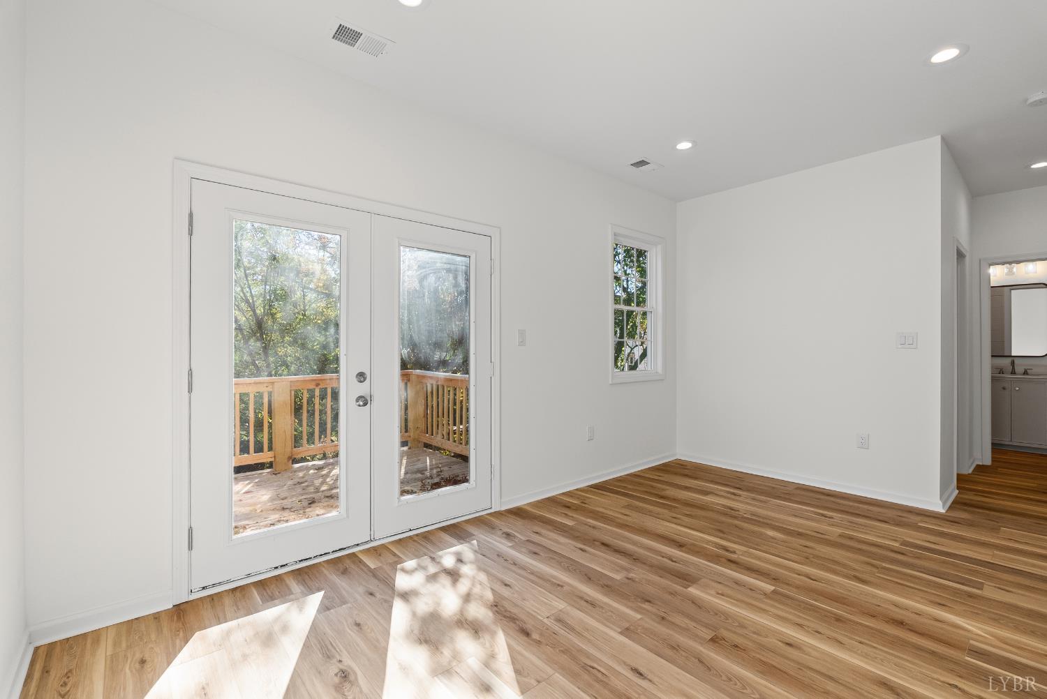 504 Amherst Street Lynchburg, VA 24504 - Photo 24 of 37 a view of empty room with wooden floor and fan