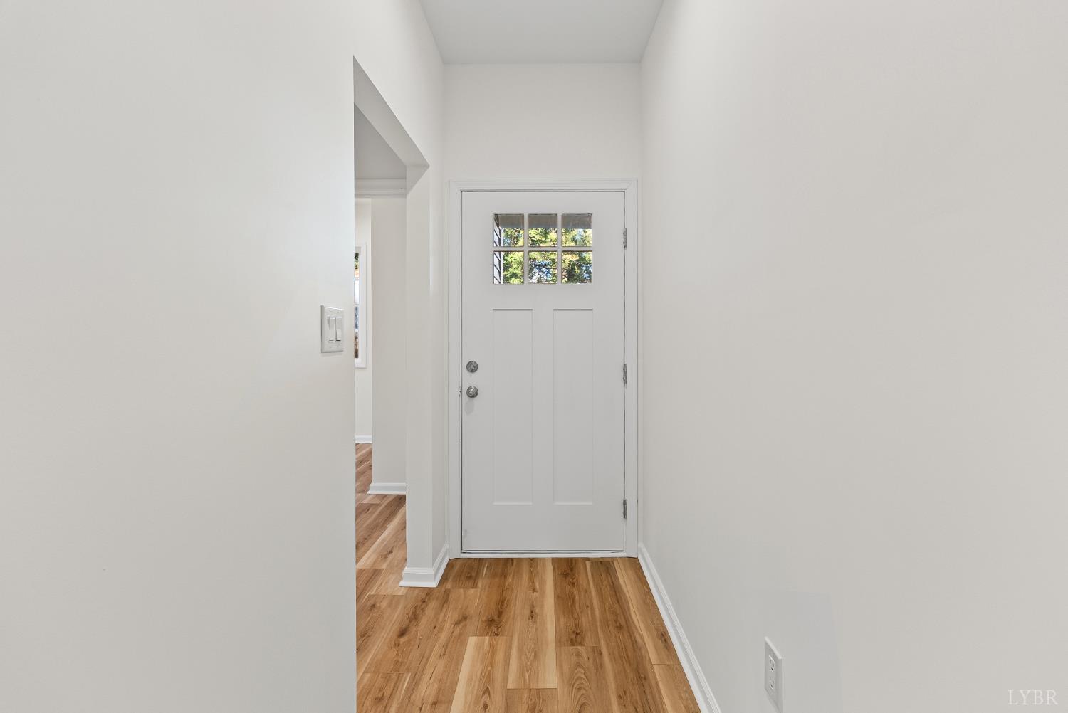 504 Amherst Street Lynchburg, VA 24504 - Photo 3 of 37 a view of a hallway with wooden floor