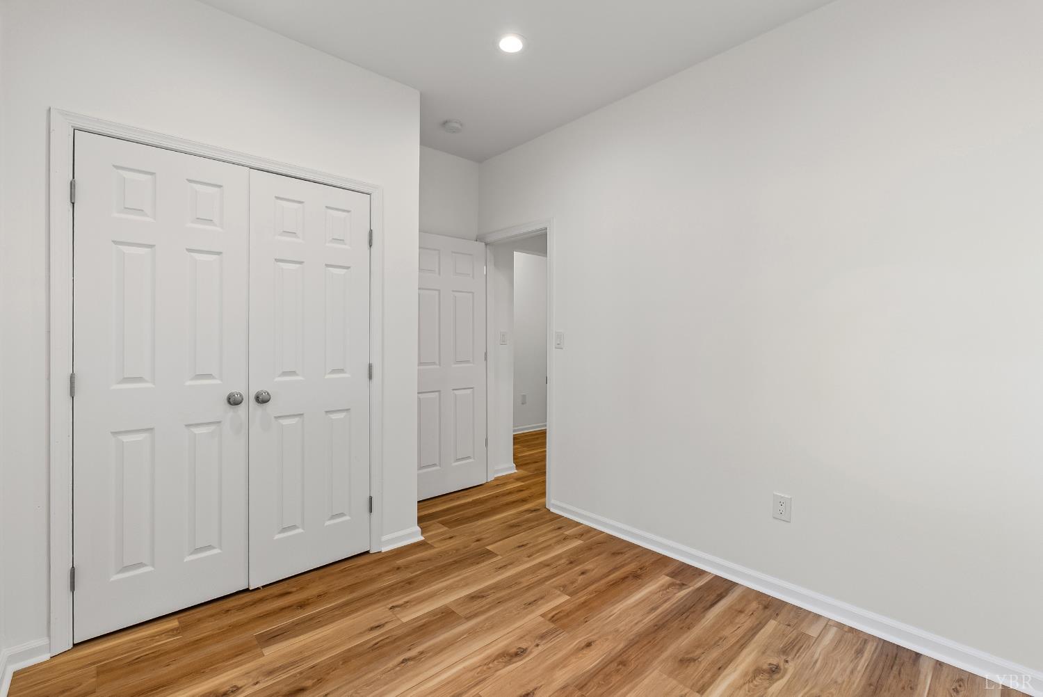 504 Amherst Street Lynchburg, VA 24504 - Photo 6 of 37 a view of an empty room with wooden floor