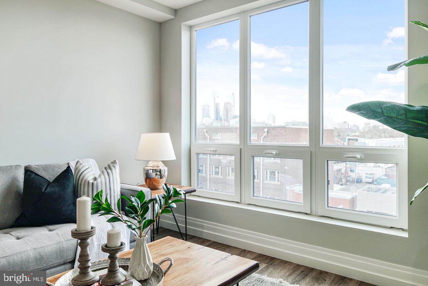 526 Brown Street, Unit 207 Philadelphia, PA 19123 - Photo 11 of 27 a living room with furniture and a large window