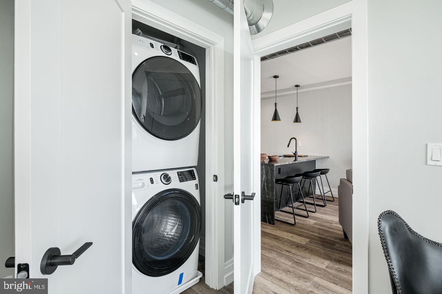526 Brown Street, Unit 207 Philadelphia, PA 19123 - Photo 15 of 27 a view of a hallway with washer and dryer