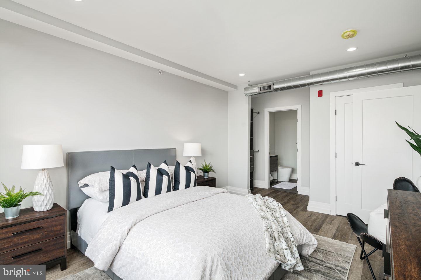 526 Brown Street, Unit 207 Philadelphia, PA 19123 - Photo 18 of 27 a spacious bedroom with a bed and a closet