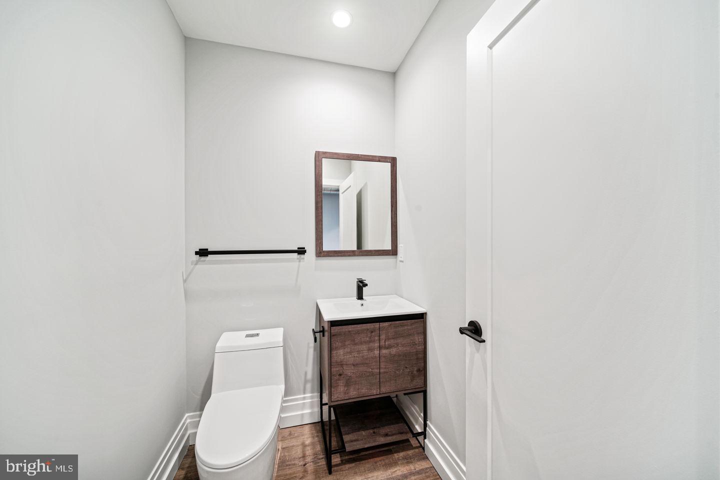 526 Brown Street, Unit 207 Philadelphia, PA 19123 - Photo 4 of 27 a bathroom with a sink toilet and mirror