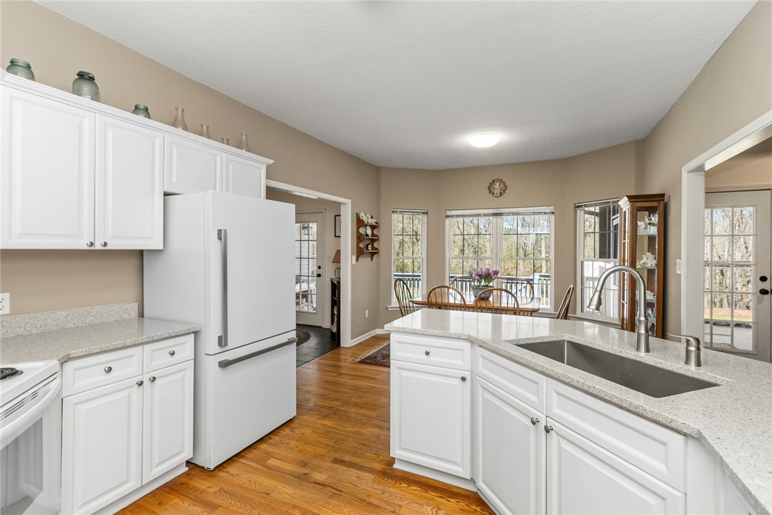 108 Pearman Drive Pendleton, SC 29670 - Photo 12 of 50 This spacious kitchen offers ample countertop space and a breakfast bar, perfect for casual dining and entertaining.