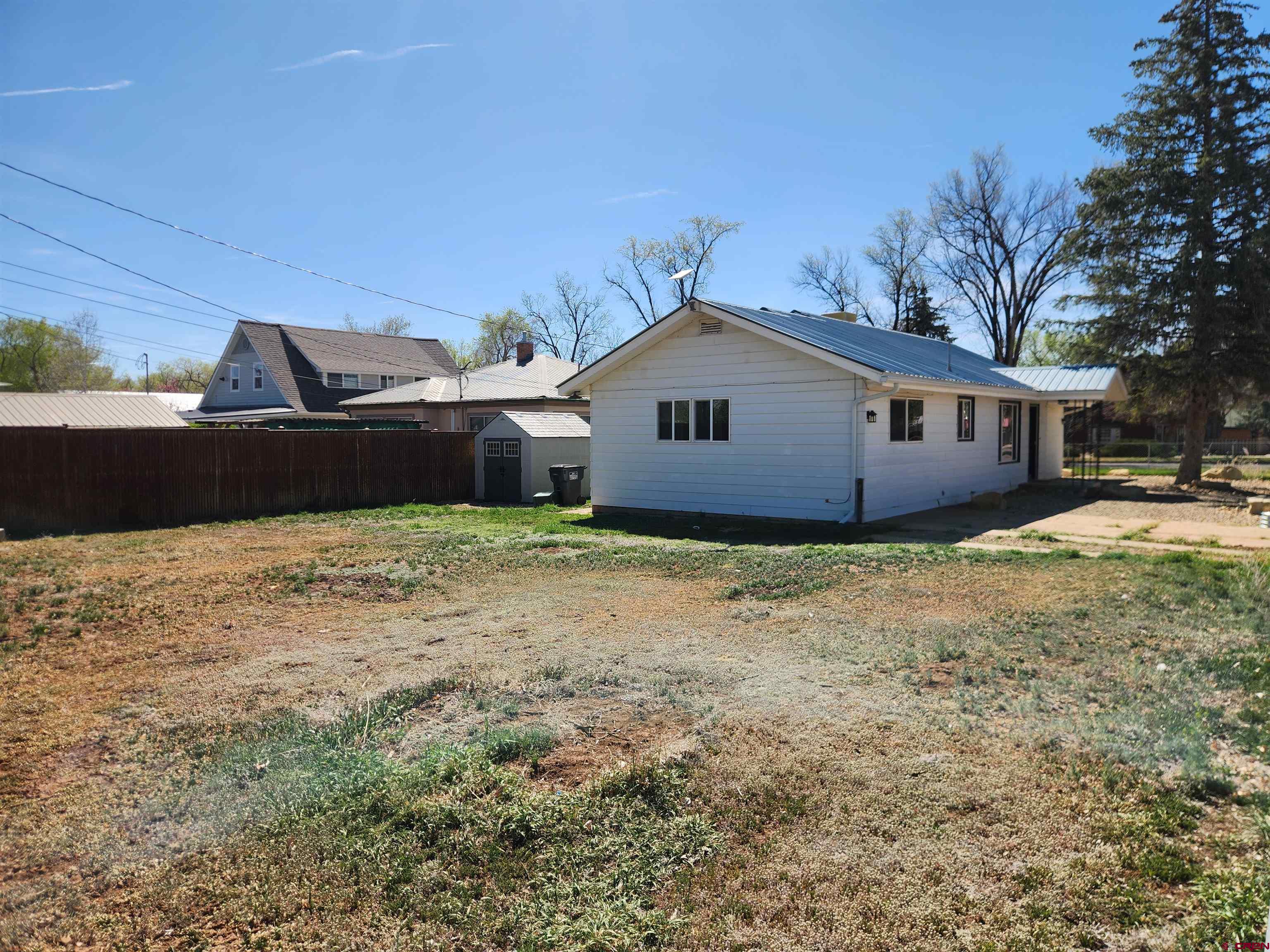 206 North Washington Street Cortez, CO 81321 - Photo 19 of 19 a front view of a house with a garden