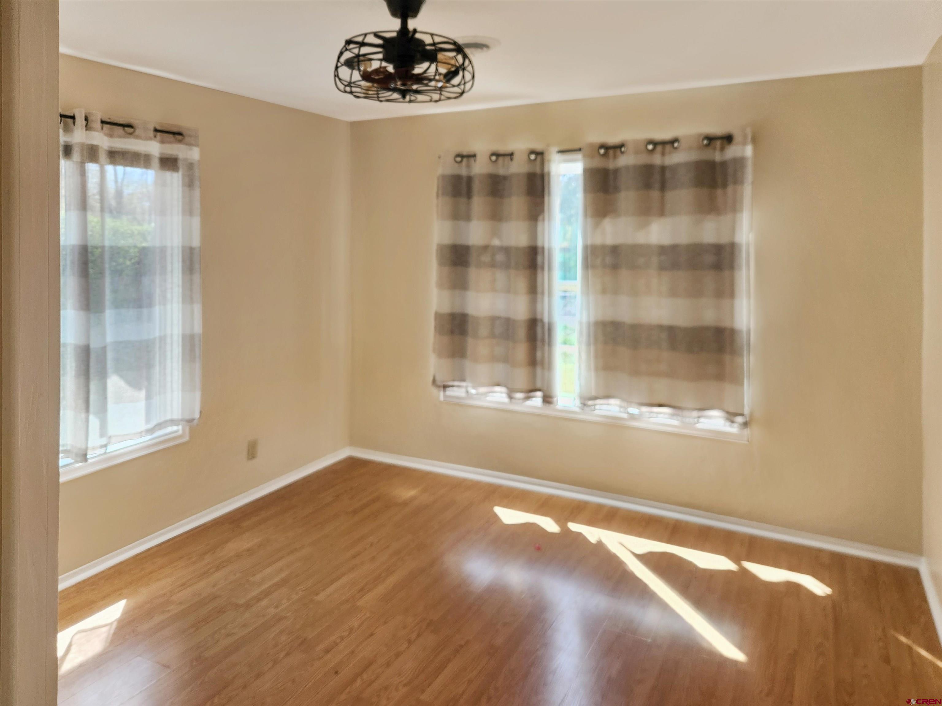 206 North Washington Street Cortez, CO 81321 - Photo 8 of 19 a view of an empty room with a window