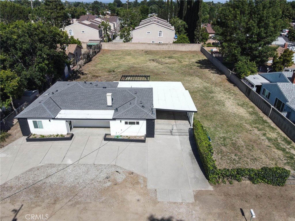 8446 Penfield Avenue Canoga Park, CA 91306 - Photo 1 of 1 a view of a yard and front of house