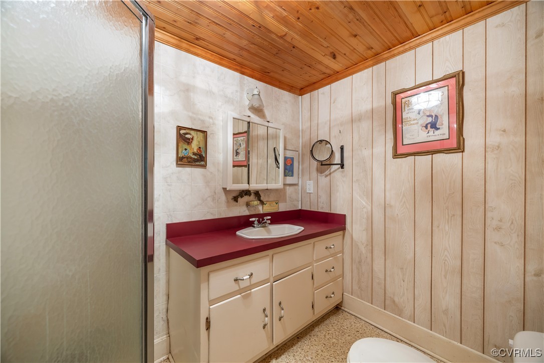 198 Trices Lake Road Columbia, VA 23038 - Photo 17 of 38 a bathroom with a granite countertop sink and a mirror