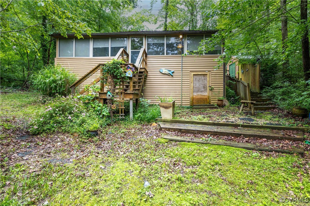 198 Trices Lake Road Columbia, VA 23038 - Photo 22 of 38 a house view with a backyard space