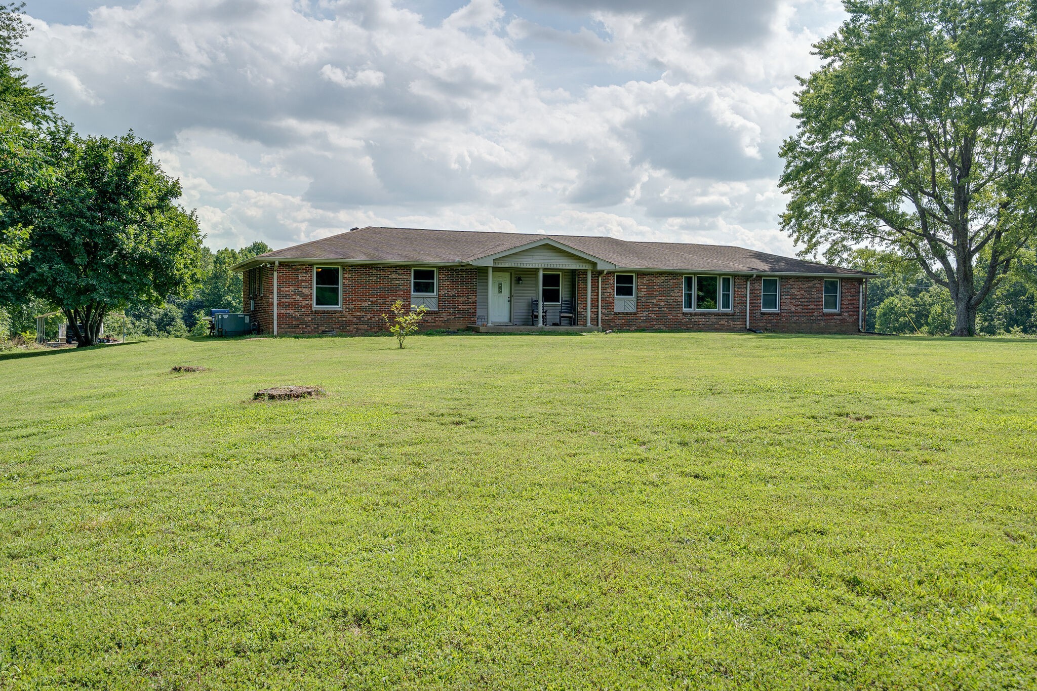 2743 Lights Chapel Road Greenbrier, TN 37073 - Photo 1 of 37 a front view of a house with a garden