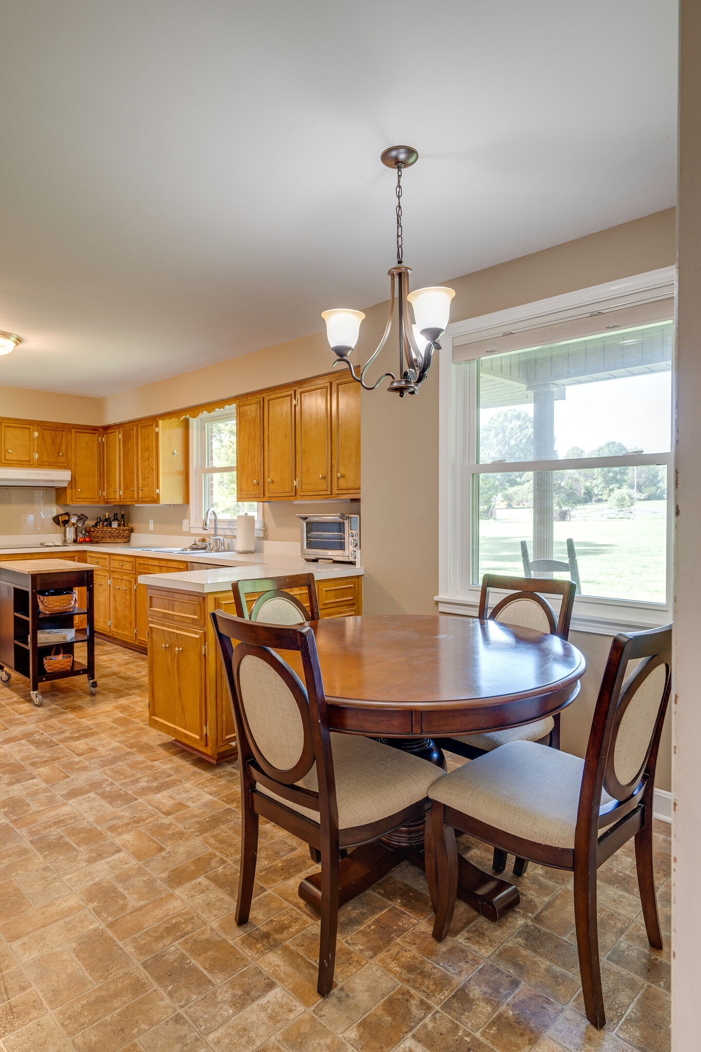 2743 Lights Chapel Road Greenbrier, TN 37073 - Photo 11 of 37 a dining room with furniture a chandelier and wooden floor