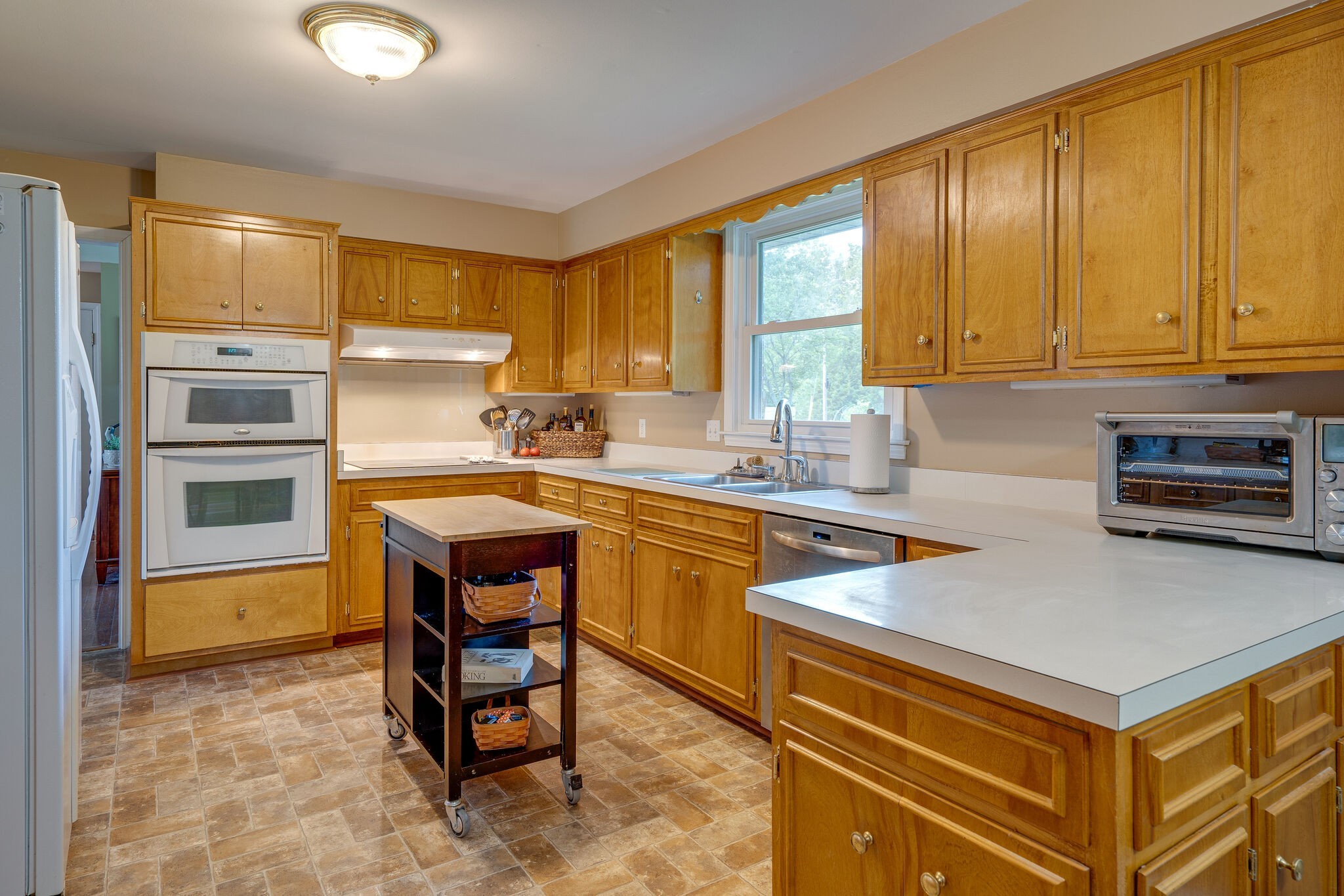 2743 Lights Chapel Road Greenbrier, TN 37073 - Photo 14 of 37 a kitchen with a refrigerator a stove a sink and a cabinets
