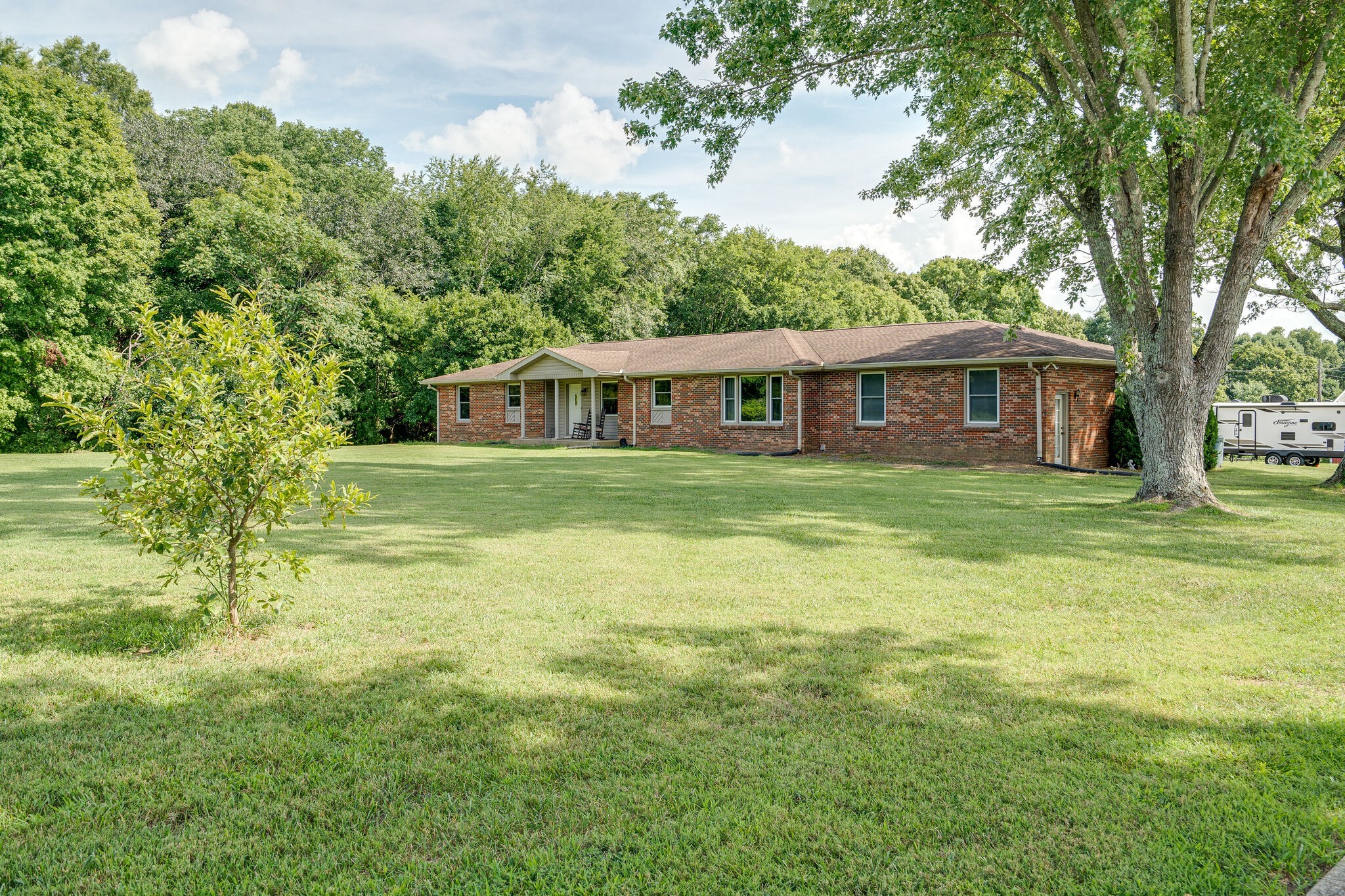 2743 Lights Chapel Road Greenbrier, TN 37073 - Photo 2 of 37 a view of a house with garden and trees