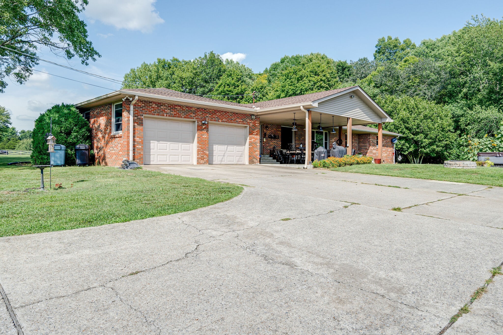 2743 Lights Chapel Road Greenbrier, TN 37073 - Photo 27 of 37 a front view of a house with a yard and garage