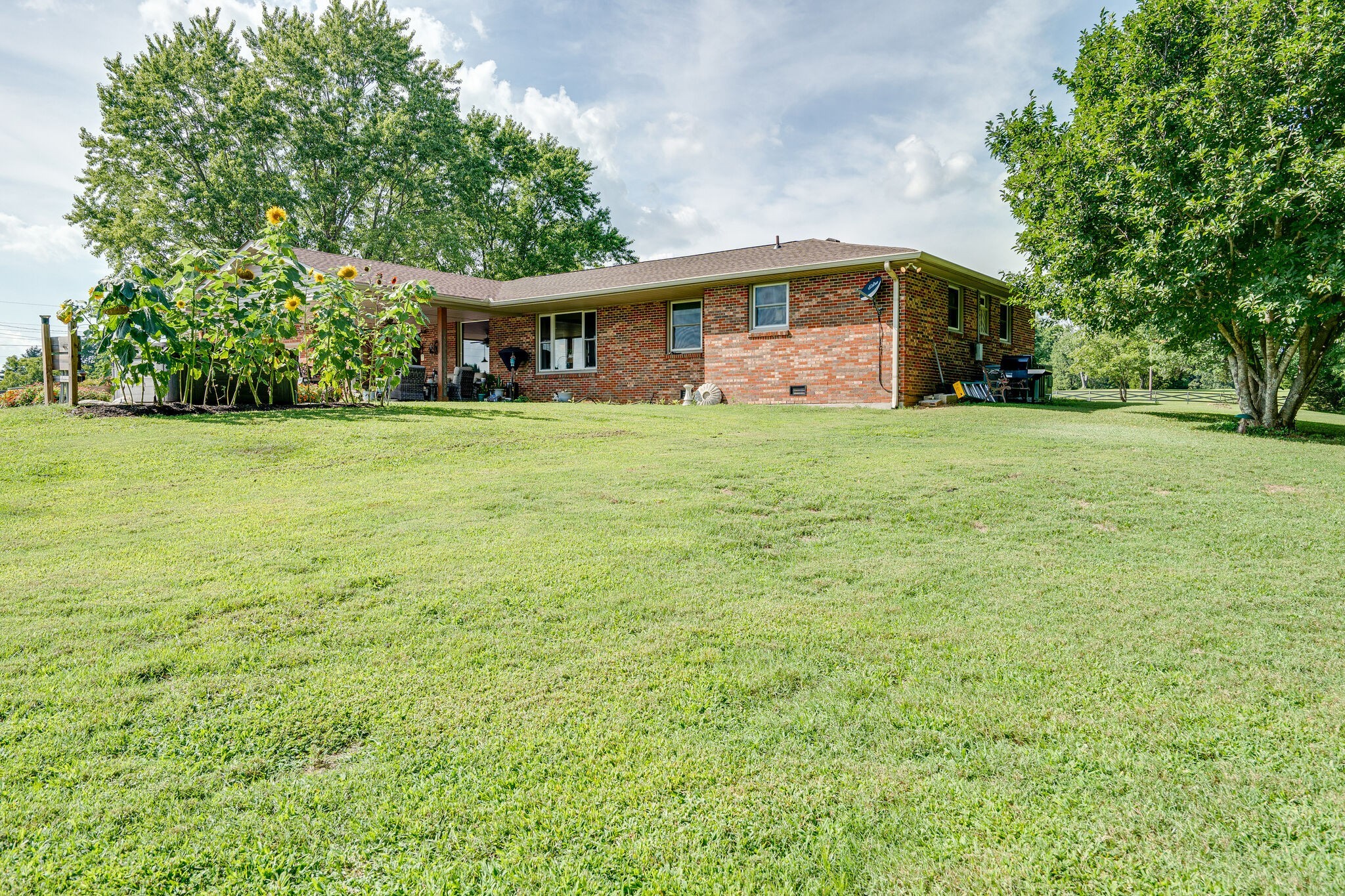 2743 Lights Chapel Road Greenbrier, TN 37073 - Photo 32 of 37 a front view of a house with a garden