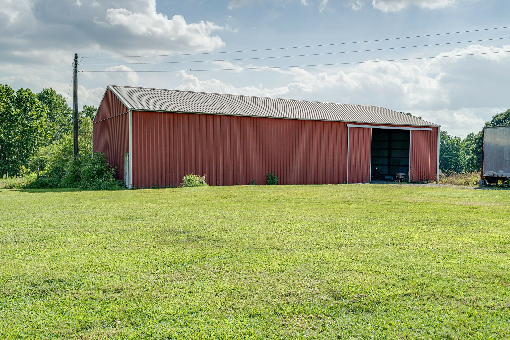 2743 Lights Chapel Road Greenbrier, TN 37073 - Photo 34 of 37 a front view of house with yard and trees