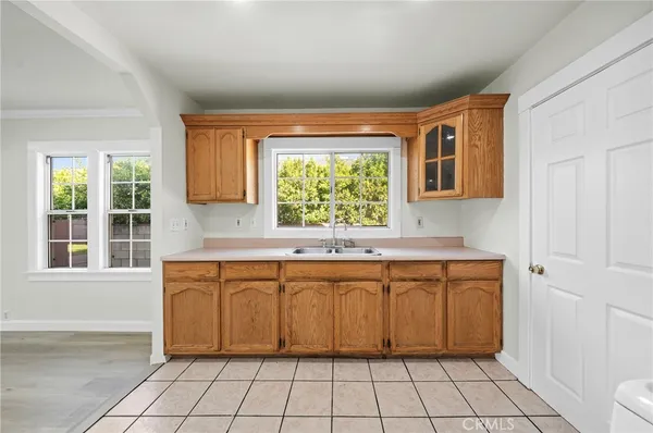 a kitchen with a sink and a window