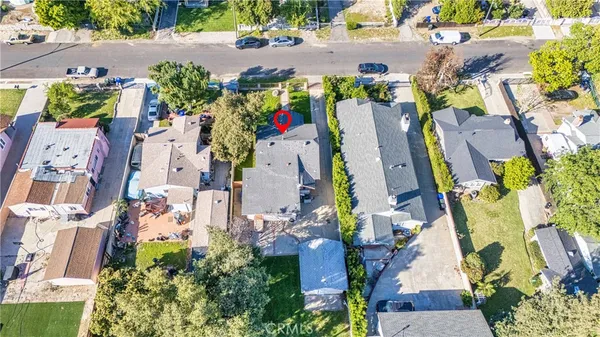 an aerial view of residential houses with outdoor space