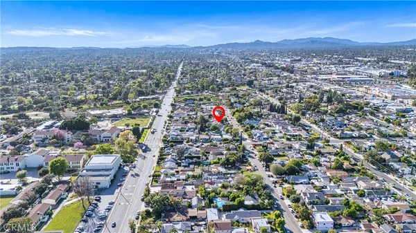 an aerial view of residential houses with city view and lake view