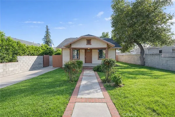 a front view of a house with yard