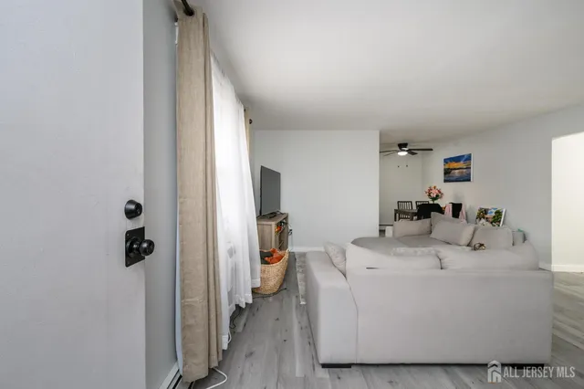 a en suite bathroom with a sink mirror and shower