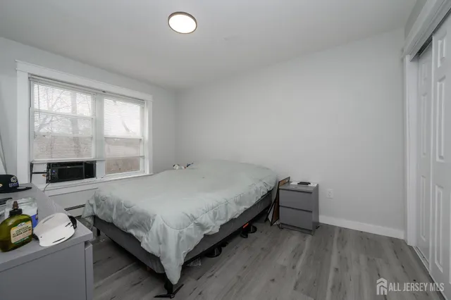 a room with a bed and a window