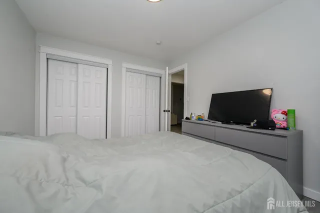 a view of a livingroom with a flat screen tv and a couch