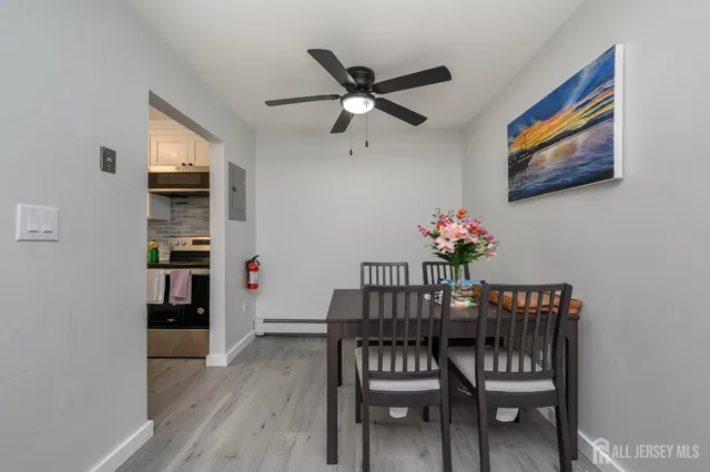 a dining room with furniture and window