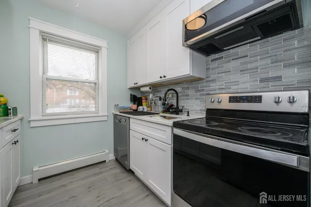 a kitchen with a stove and a microwave