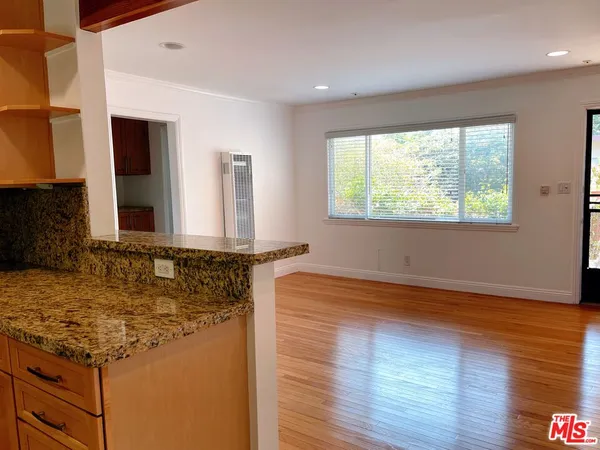 a kitchen with sink and window