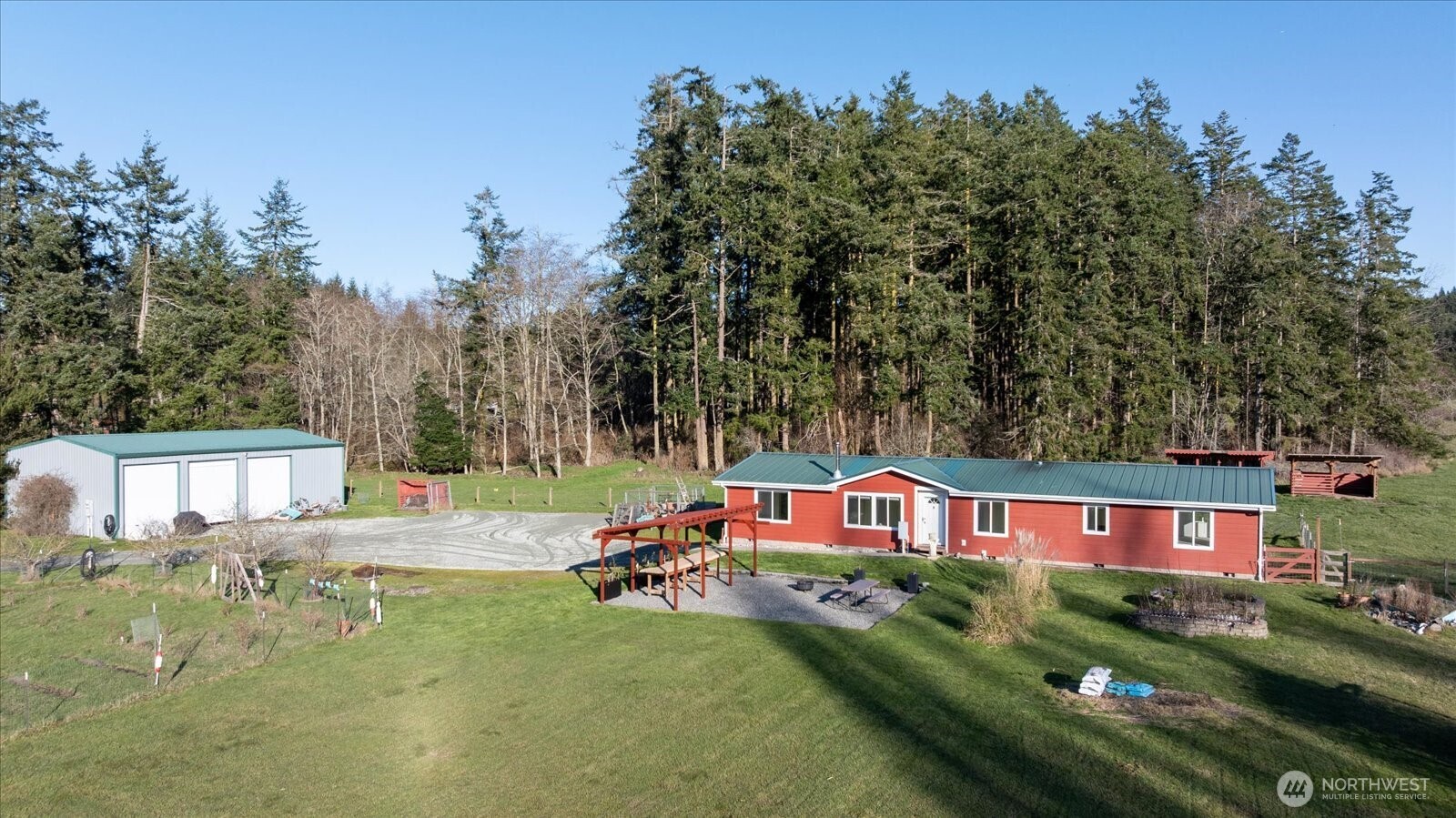 an aerial view of a house with swimming pool patio and outdoor seating