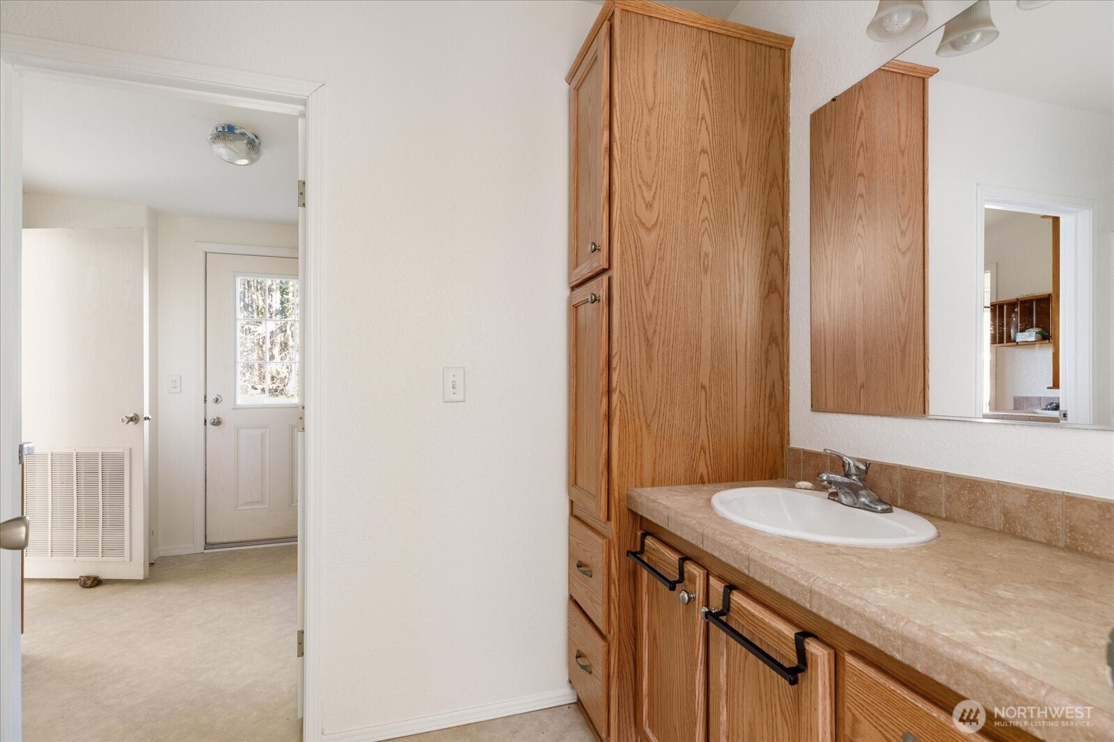 4522 Monkey Hill Road Oak Harbor, WA 98277 - Photo 13 of 40 a bathroom with a granite countertop sink and a mirror