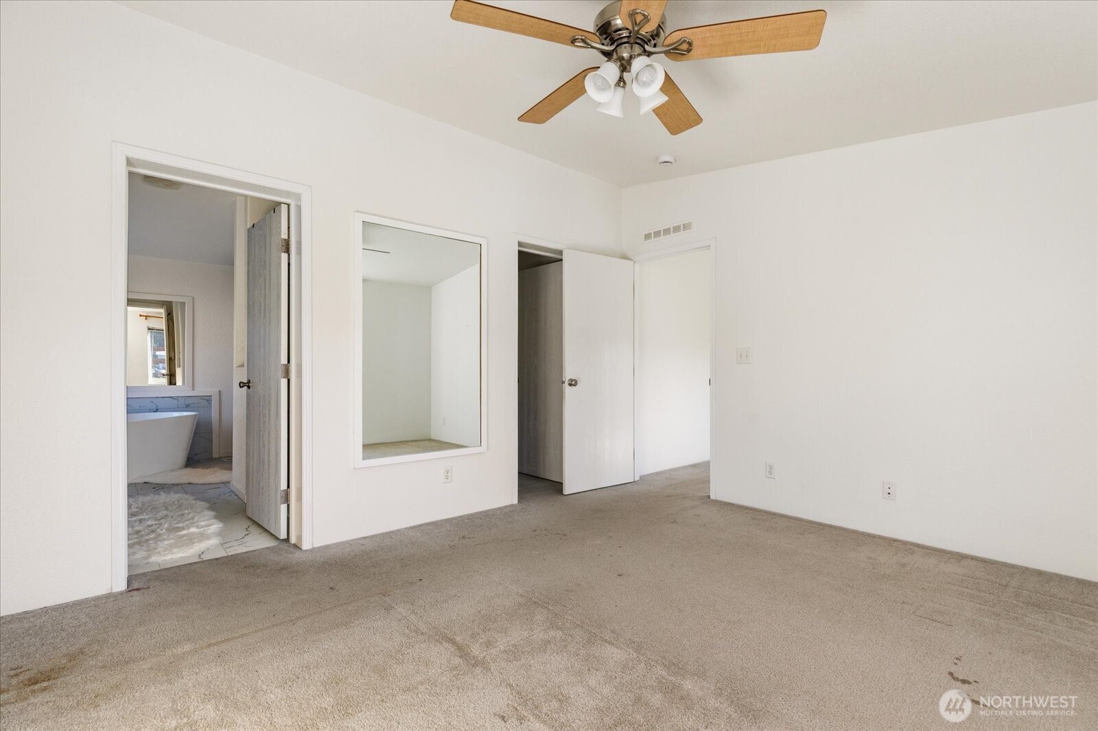4522 Monkey Hill Road Oak Harbor, WA 98277 - Photo 15 of 40 a view of an empty room and bathroom with a fan