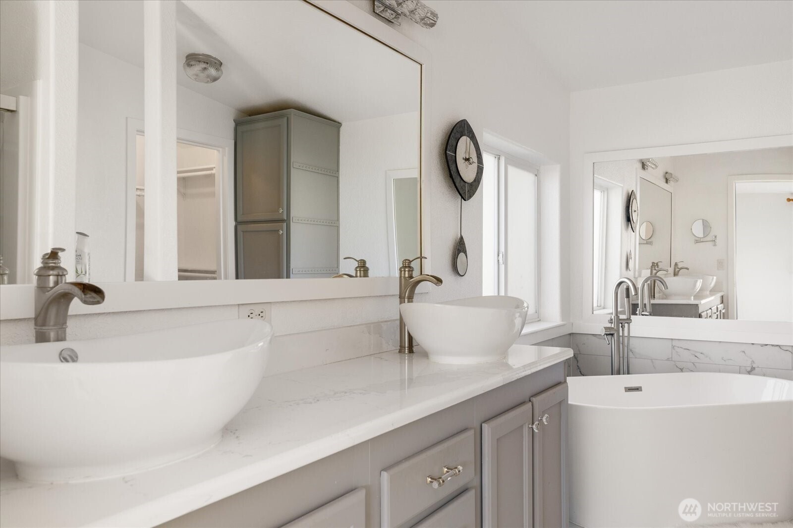 4522 Monkey Hill Road Oak Harbor, WA 98277 - Photo 16 of 40 a bathroom with a double vanity sink and a mirror