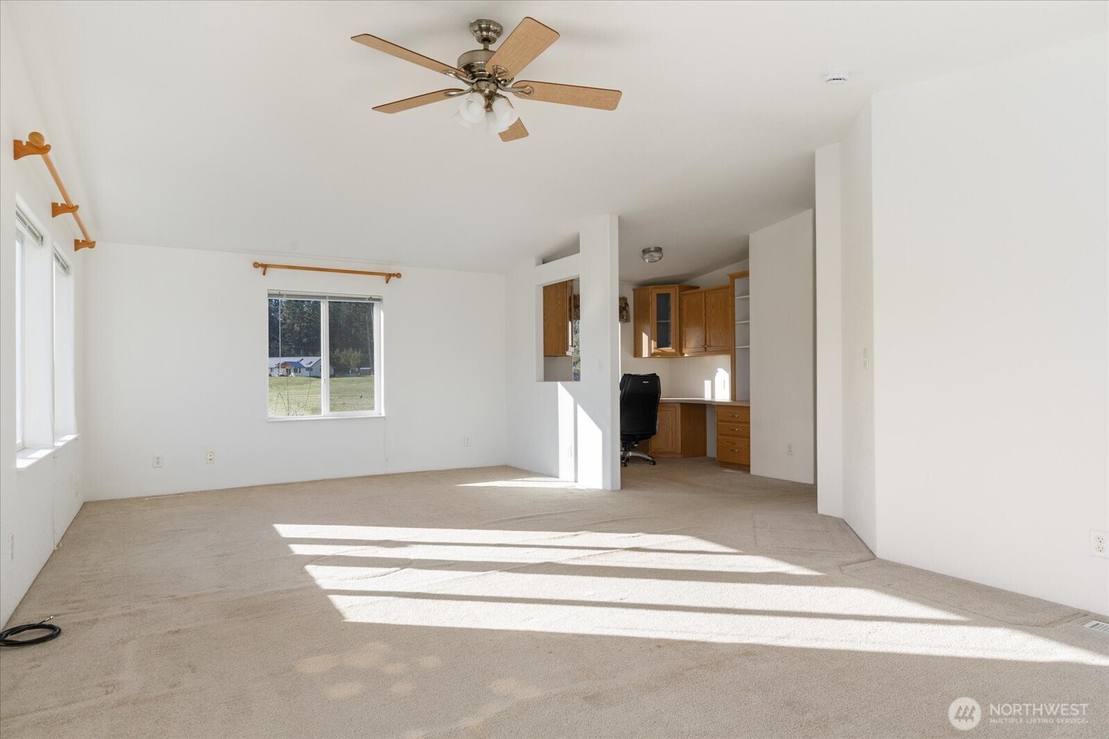 4522 Monkey Hill Road Oak Harbor, WA 98277 - Photo 22 of 40 a bedroom with a bed and a chandelier