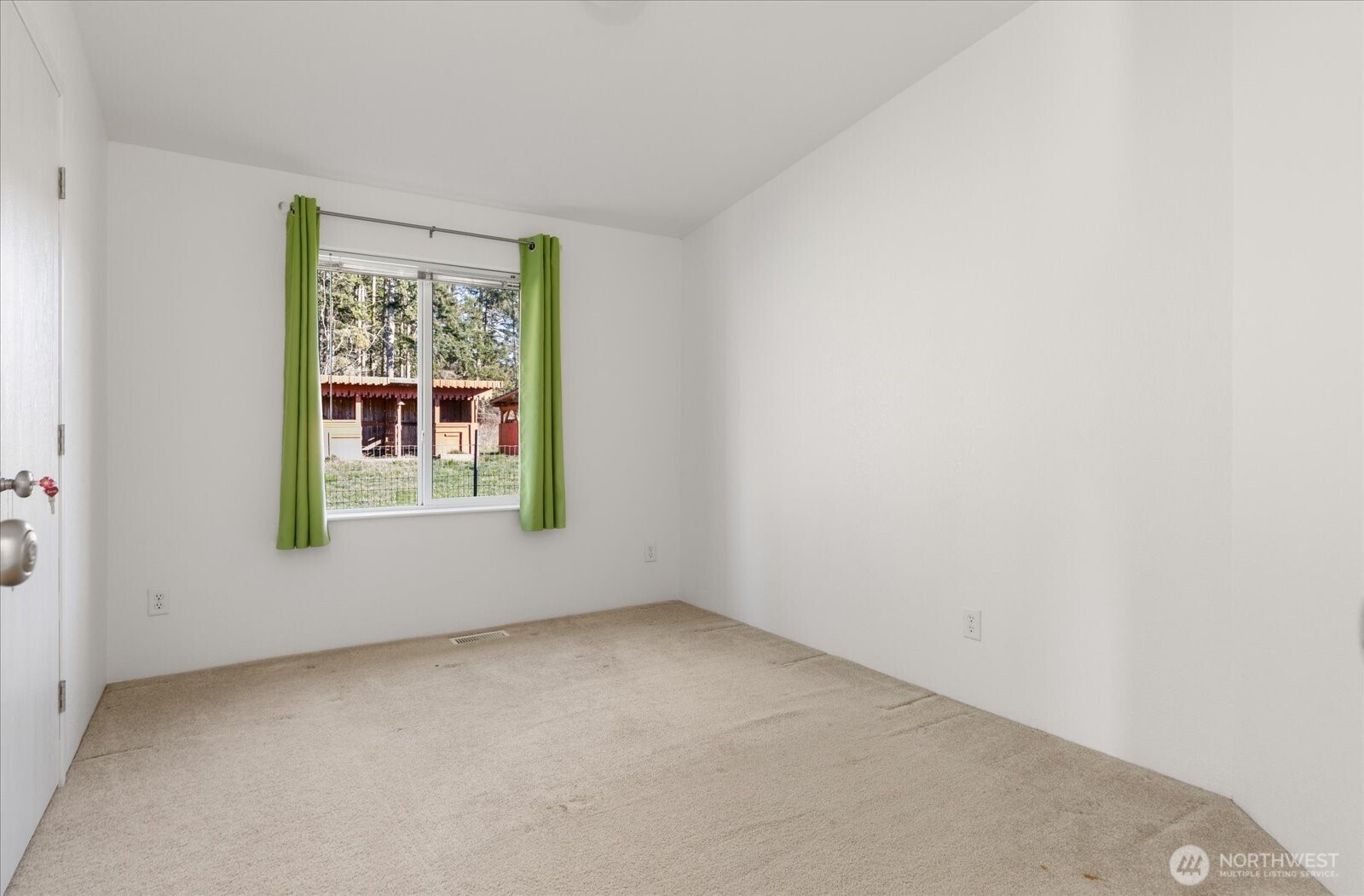 4522 Monkey Hill Road Oak Harbor, WA 98277 - Photo 24 of 40 an empty room with windows