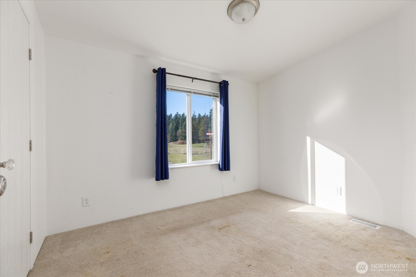 4522 Monkey Hill Road Oak Harbor, WA 98277 - Photo 26 of 40 a view of an empty room with a window