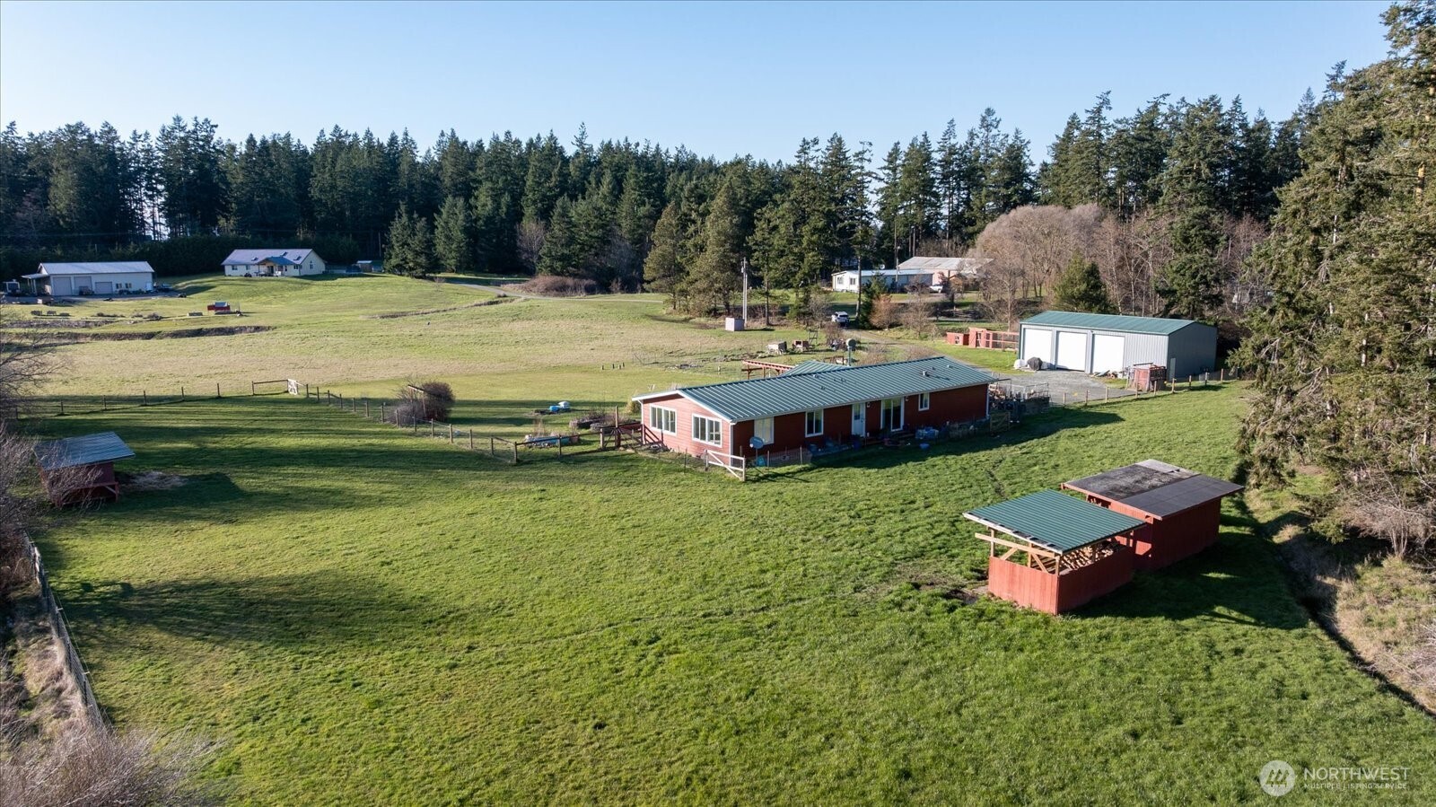 4522 Monkey Hill Road Oak Harbor, WA 98277 - Photo 32 of 40 a view of a house with swimming pool and a yard