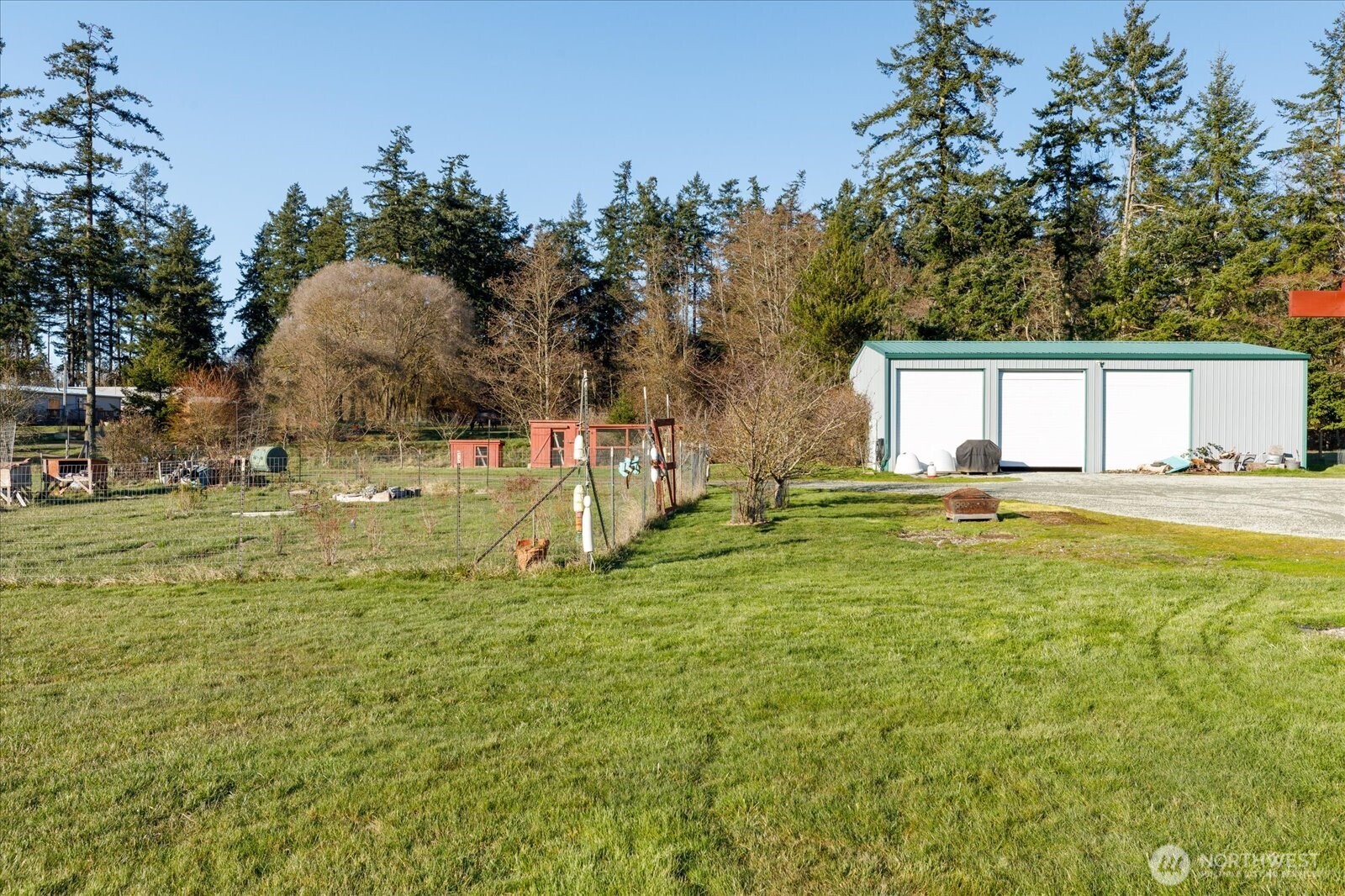 4522 Monkey Hill Road Oak Harbor, WA 98277 - Photo 35 of 40 a backyard of a house with lots of green space