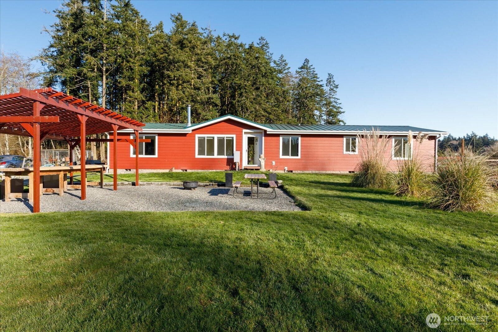 4522 Monkey Hill Road Oak Harbor, WA 98277 - Photo 37 of 40 a front view of a house with a yard table and chairs