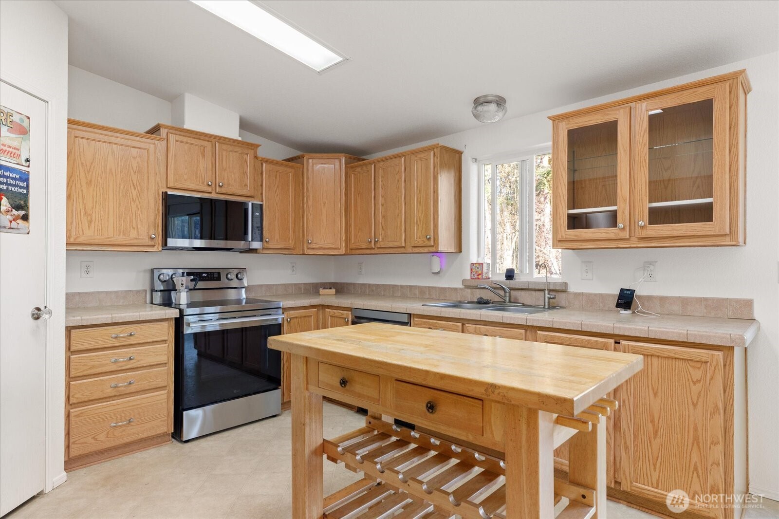 4522 Monkey Hill Road Oak Harbor, WA 98277 - Photo 9 of 40 a kitchen with a sink stove and microwave