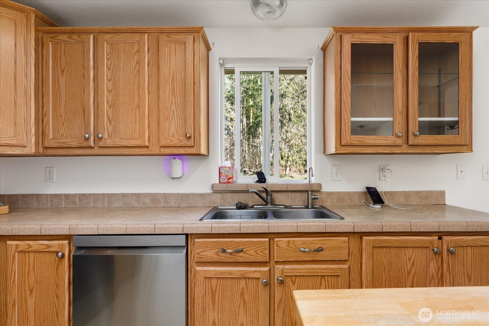 4522 Monkey Hill Road Oak Harbor, WA 98277 - Photo 10 of 40 a kitchen with stainless steel appliances granite countertop white cabinets sink and a granite counter top