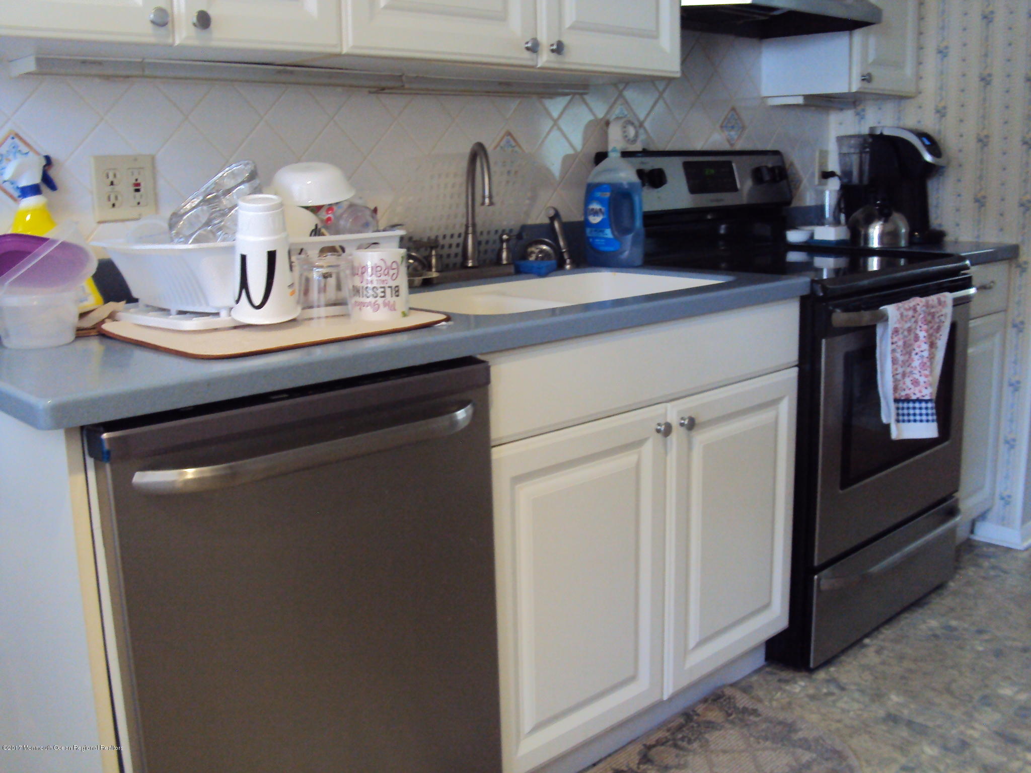 38 Hartford Road, Unit 73 Whiting, NJ 08759 - Photo 12 of 25 a kitchen with a sink and cabinets