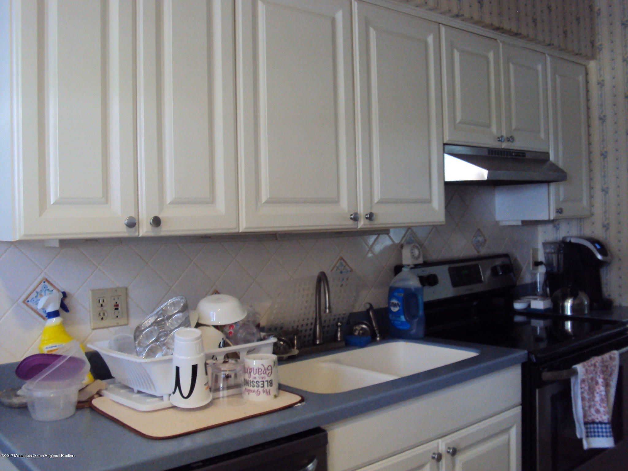 38 Hartford Road, Unit 73 Whiting, NJ 08759 - Photo 13 of 25 a kitchen with a sink and cabinets