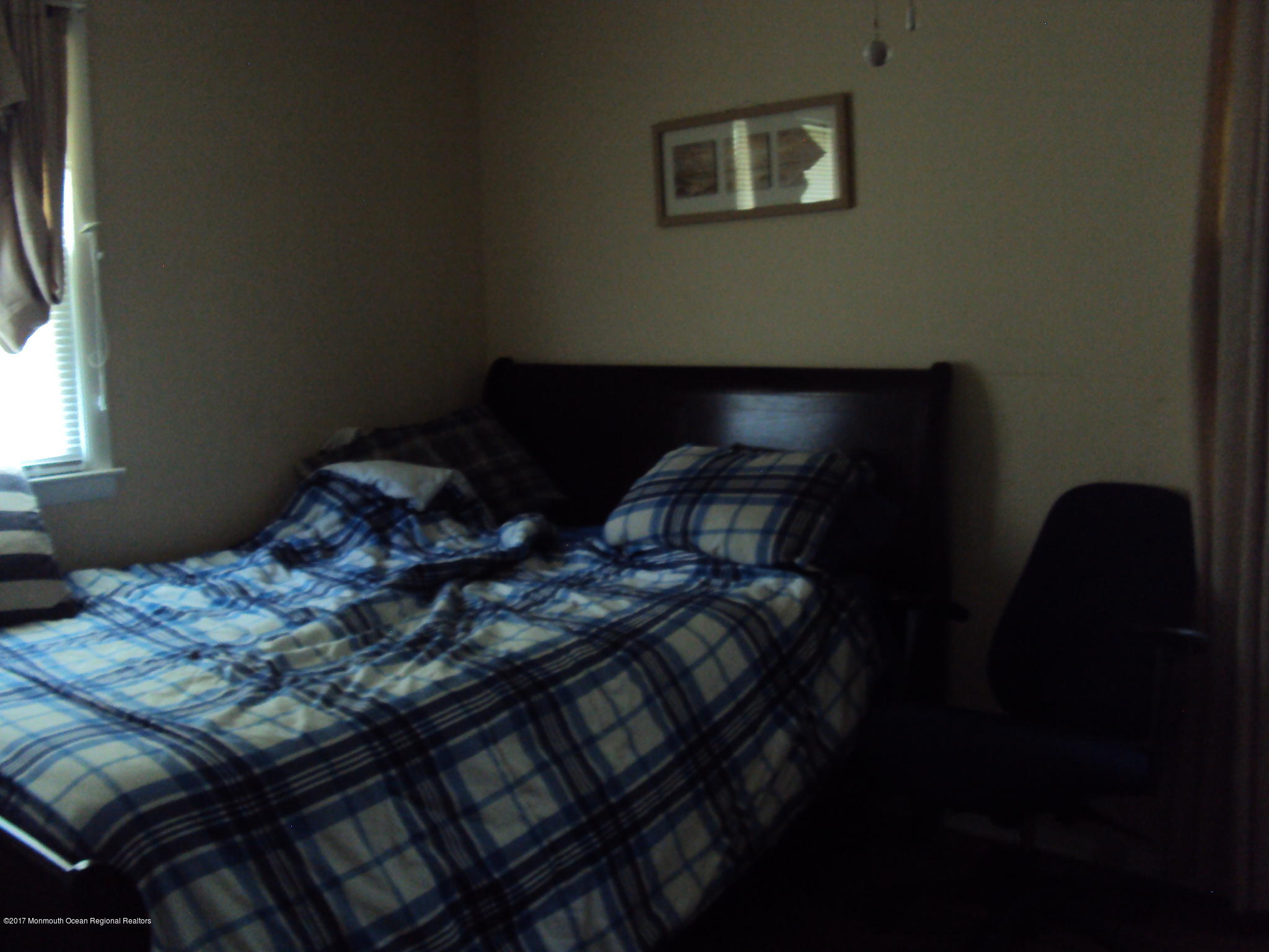 38 Hartford Road, Unit 73 Whiting, NJ 08759 - Photo 18 of 25 a bed sitting in a bedroom next to a window
