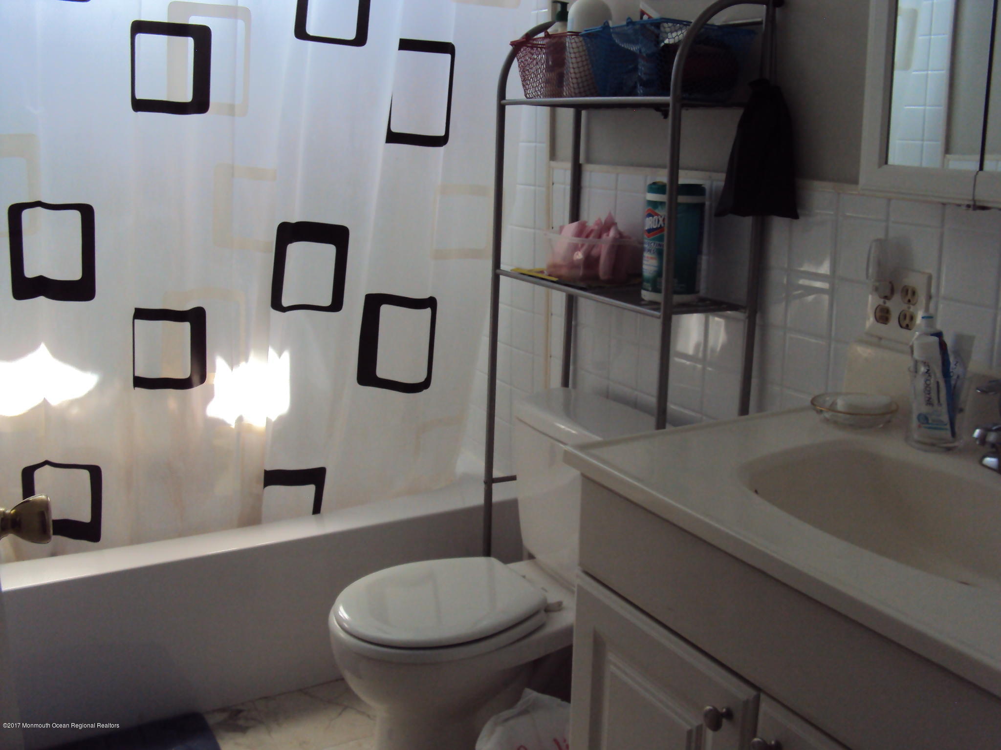 38 Hartford Road, Unit 73 Whiting, NJ 08759 - Photo 21 of 25 a bathroom with a sink a toilet and shower