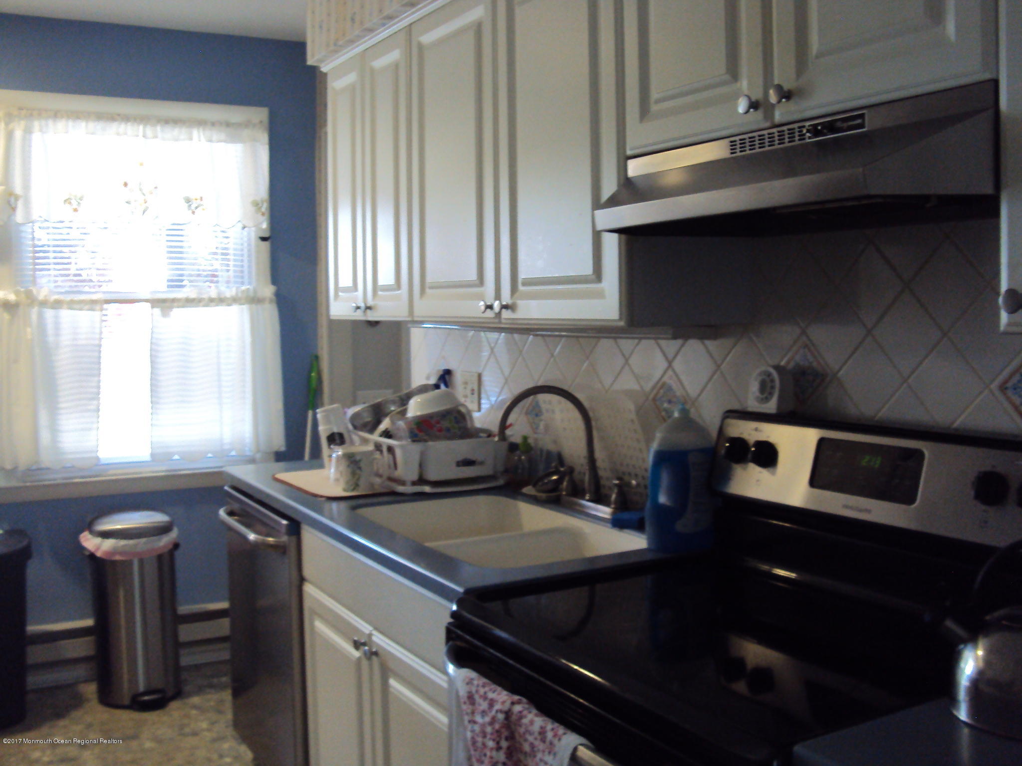 38 Hartford Road, Unit 73 Whiting, NJ 08759 - Photo 8 of 25 a kitchen with a sink cabinets and window