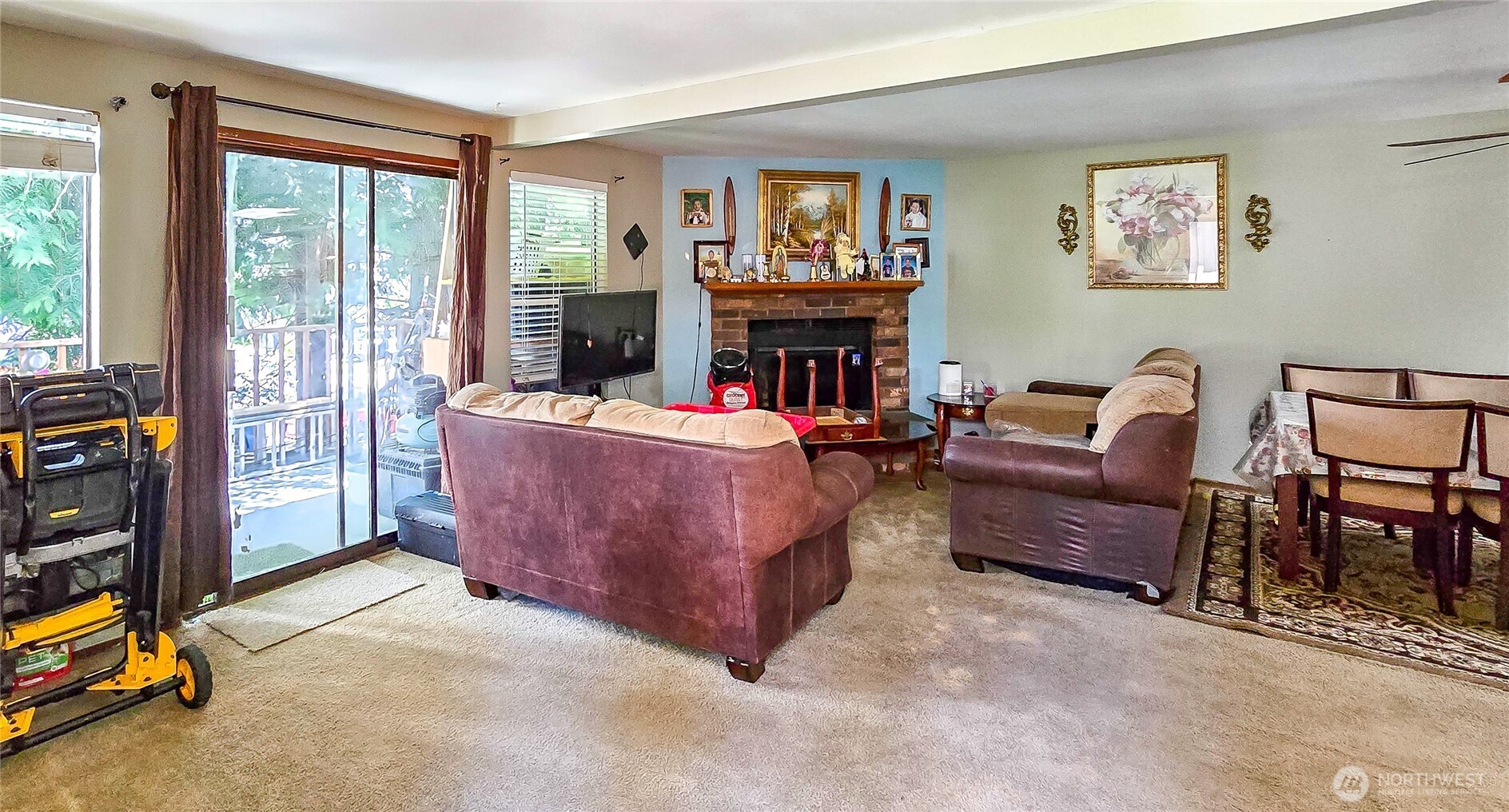 15609 8th Avenue Southwest Burien, WA 98166 - Photo 15 of 26 a living room with furniture a flat screen tv and a fireplace